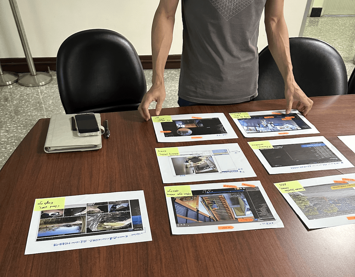 Printed design boards laid out during a project review